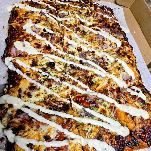 The Pig Hen BBQ Chicken, Bacon & Onion Pizza.